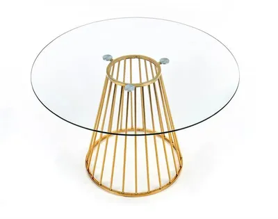 A round glass-top table with a golden metal base.