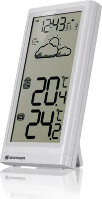 A white digital weather station with a stand, displaying time, temperature, and weather icons.