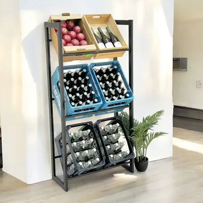 A metal shelving unit filled with produce and beverages, placed against a wall.