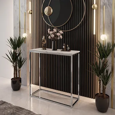 A modern console table with a marble top and chrome frame, decorated with plants and vases, in a stylish interior setting.