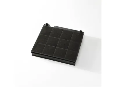 A black charcoal filter for a range hood or other appliance, viewed from a slightly elevated angle on a white background.