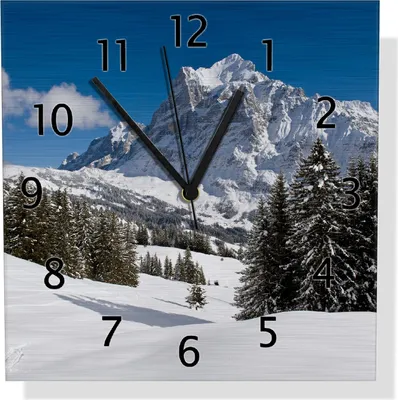 Produktbild von Wallario Design Wanduhr Verschneiter Berghang unter blauem Himmel aus Aluverbund, Größe 30 x 30 cm