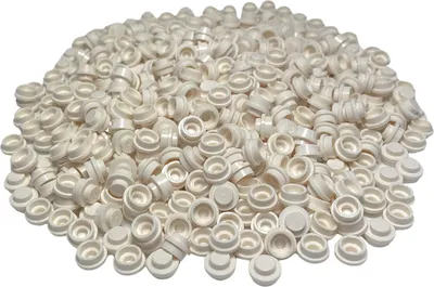 A pile of small, white, round LEGO plates.