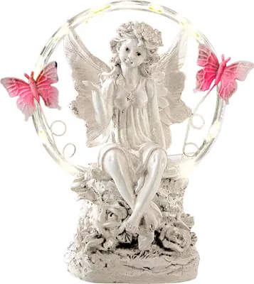 A white fairy figurine with pink butterflies and LED lights.