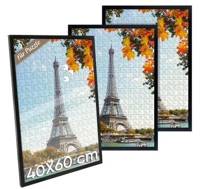 Three framed puzzles of the Eiffel Tower in Paris, with autumn leaves visible.