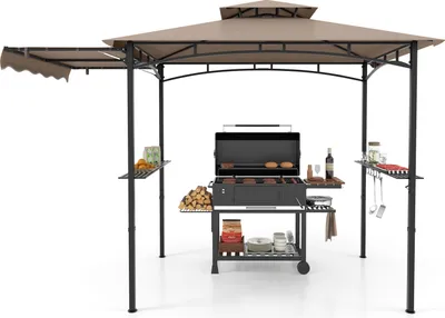 A grill pavilion with a grill and accessories set up on a white background.