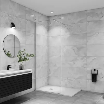 A modern bathroom with a walk-in shower, vanity, and mirror.