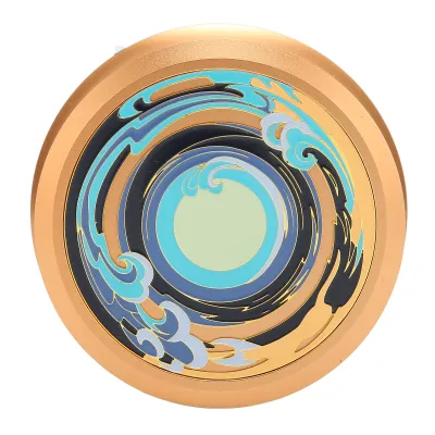 A top-down view of a gold disc stabilizer with a swirling blue and black design.