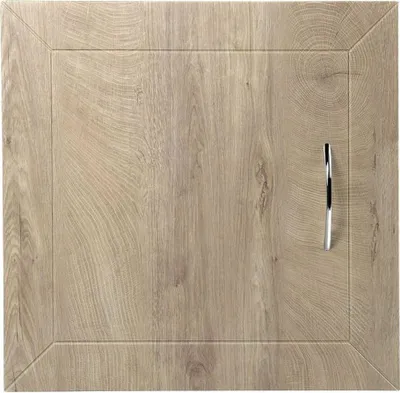 A close-up view of a wooden cabinet door with a silver handle.