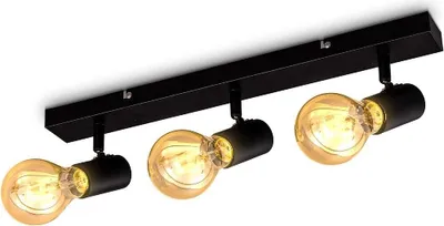 A black ceiling spotlight with three exposed Edison-style light bulbs.