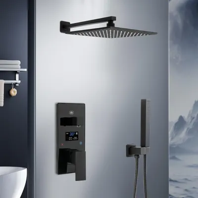 A modern black shower system with a square overhead shower head, a wall-mounted control panel with a digital display, and a handheld shower head, set against a light gray wall with a hint of a mountain landscape on the right.