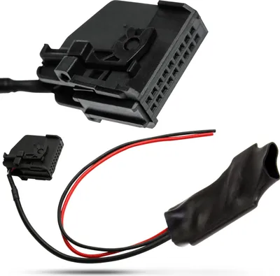 A black car radio adapter cable with two connectors and wires is shown against a white background.