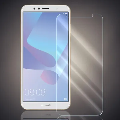 A smartphone with a screen protector placed next to it, presented against a dark background.