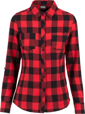 A red and black checkered flannel shirt is laid flat.