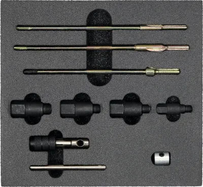 A set of tools for cleaning spark plug connectors, laid out in a black foam insert.