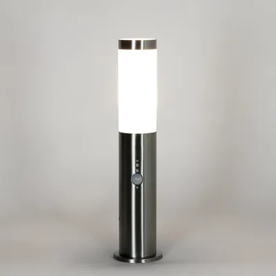 A modern, cylindrical outdoor lamp with a motion sensor.
