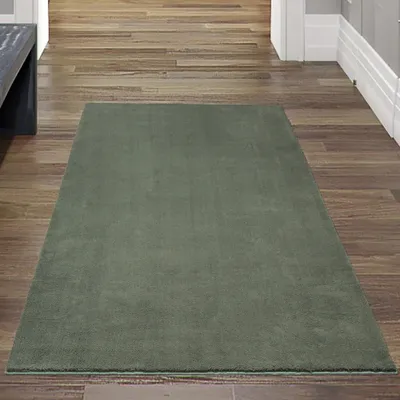 Produktbild von Hochflor-Teppich in tiefem Dunkelgrün – Luxus und Wohlfühlen vereint! Größe - 60 x 110 cm