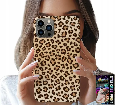 A woman holds up a leopard print phone case in front of her face.