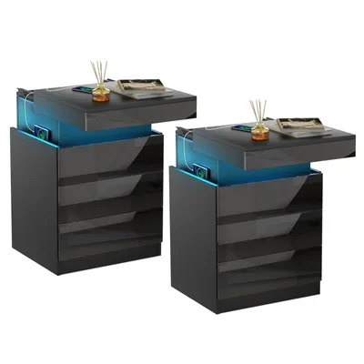 Two black nightstands with blue LED lighting and charging ports.