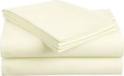 A stack of folded cream-colored bed sheets.