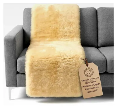 Produktbild von Sesselauflage aus Lammfell 50x150cm – echtes Schaffell, medizinisch gegerbt & chromfrei | Weich, warm & atmungsaktiv | Ideal für Senioren, Sessel, Bett oder Rollstuhl.