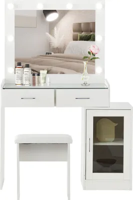 A white vanity set with a mirror, stool, and cabinet, set against a neutral background.