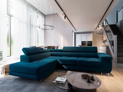 A modern living room with a large sectional sofa, dining table and chairs in the background, and a staircase on the right.