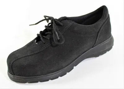 A black suede shoe is shown against a white background.