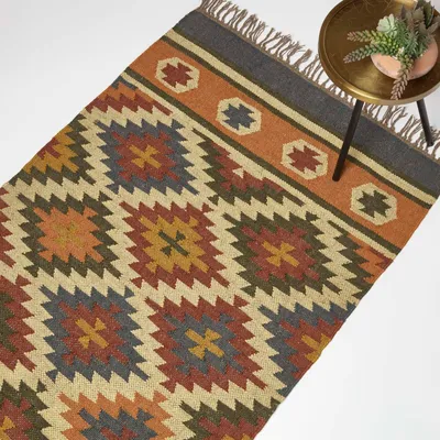 Produktbild von HOMESCAPES Handgewebter Juteteppich Lucea – 90 x 150 cm, Kelim-Muster orange-blau