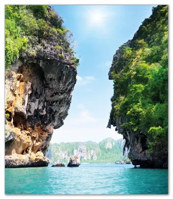 Produktbild von Wallario Herdabdeckplatte aus Glas, Größe 52 x 60 cm 1-teilig, Motiv Felsenschlucht am Meer in Thailand