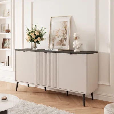 A modern sideboard with a dark top and light-colored doors, decorated with a floral arrangement and a bust sculpture.