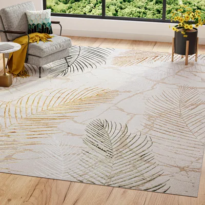 A living room scene with a chair, a rug, and a plant.