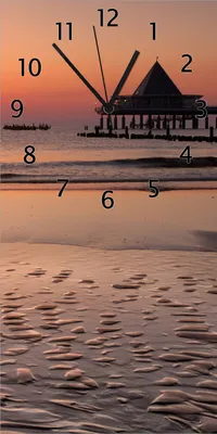Produktbild von Wallario Design Wanduhr Strand am Abend - Seebrücke am Ostseebad Heringsdorf aus Echtglas, Größe 30 x 60 cm