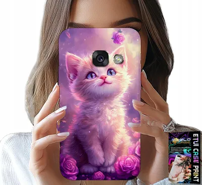 A person is holding up a phone case with a kitten and roses design.