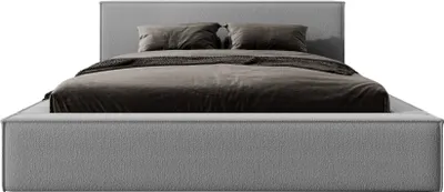 A bed with gray upholstery and bedding, shown from the front.