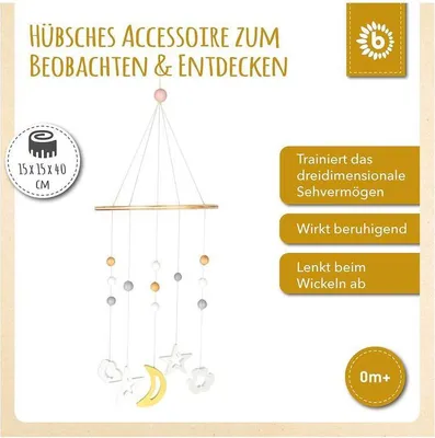 A baby mobile hanging from a wooden bar, with decorative elements like moons, stars, and clouds.