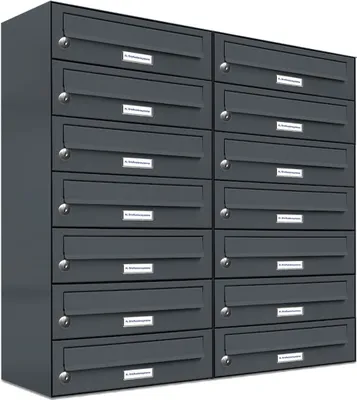 A wall of dark gray mailboxes.
