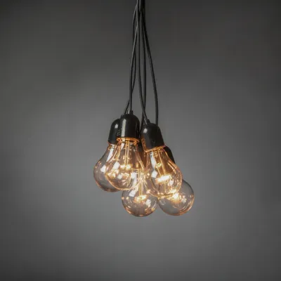 Produktbild von Konstsmide - LED Biergartenkette Lichtervorhang , 10 klare Birnen / 80 bernsteinfarbene Dioden, 24V_Außentrafo, schwarzes Kabel - 2383-800