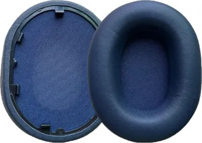 Two blue ear pads for headphones are shown against a white background. One ear pad is shown from the side, and the other is shown from the front with the inner mesh visible.