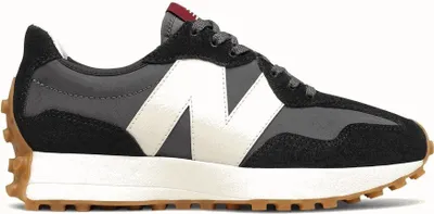 A studio shot of a single New Balance sneaker.