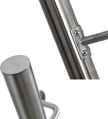 Close-up view of a stainless steel handrail and its mounting bracket.