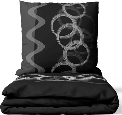 A folded bed linen set with a pillow and duvet cover.