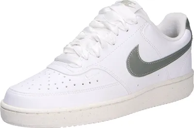 A single white Nike Court Vision Lo NN sneaker with gray accents and white satin laces is shown against a white background.