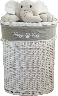 A white wicker laundry basket with a gray fabric liner and a plush elephant toy peeking out from the top.