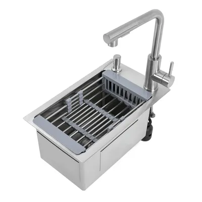 A stainless steel kitchen sink with a faucet and a dish drying rack.
