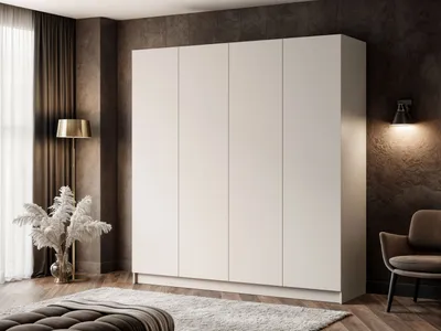 A modern bedroom with a large white wardrobe, a chair, and decorative plants.
