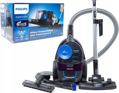 A Philips PowerPro Compact vacuum cleaner and its packaging are displayed against a white background.