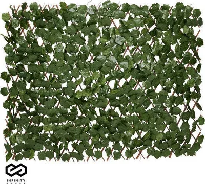 A close-up view of an artificial ivy fence.