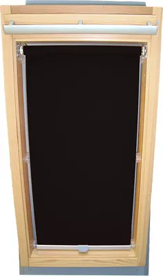A black roller blind is installed in a wooden skylight window frame.