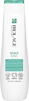 A white bottle of Biolage Professional Scalp Sync Calming Shampoo against a white background.